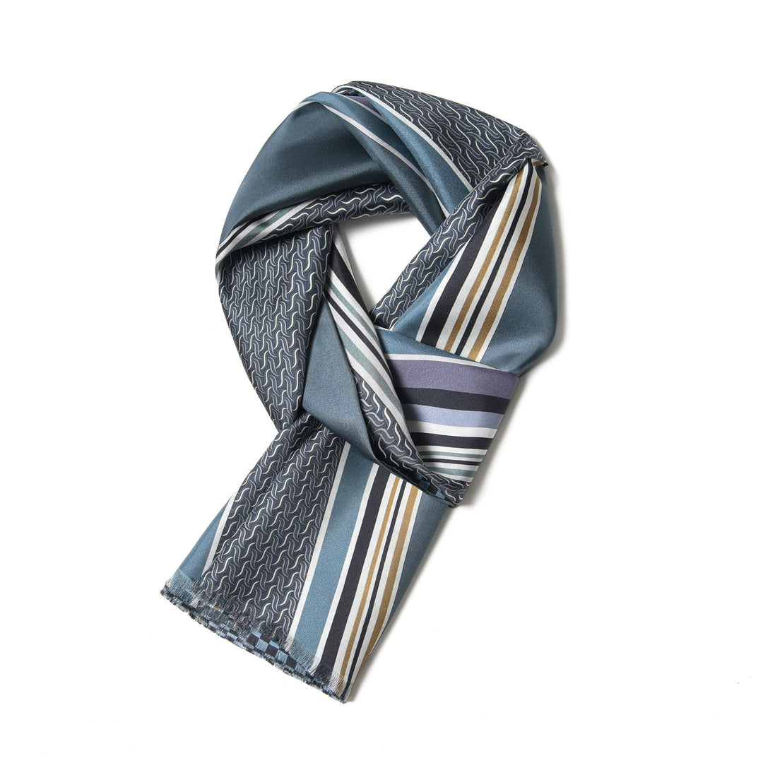 The Luxurious Men's Silk Twill Scarf in Grey Khaki by SusanSilk features a beige and gray silk material with a striped pattern on one side and a brown checkered pattern on the other.