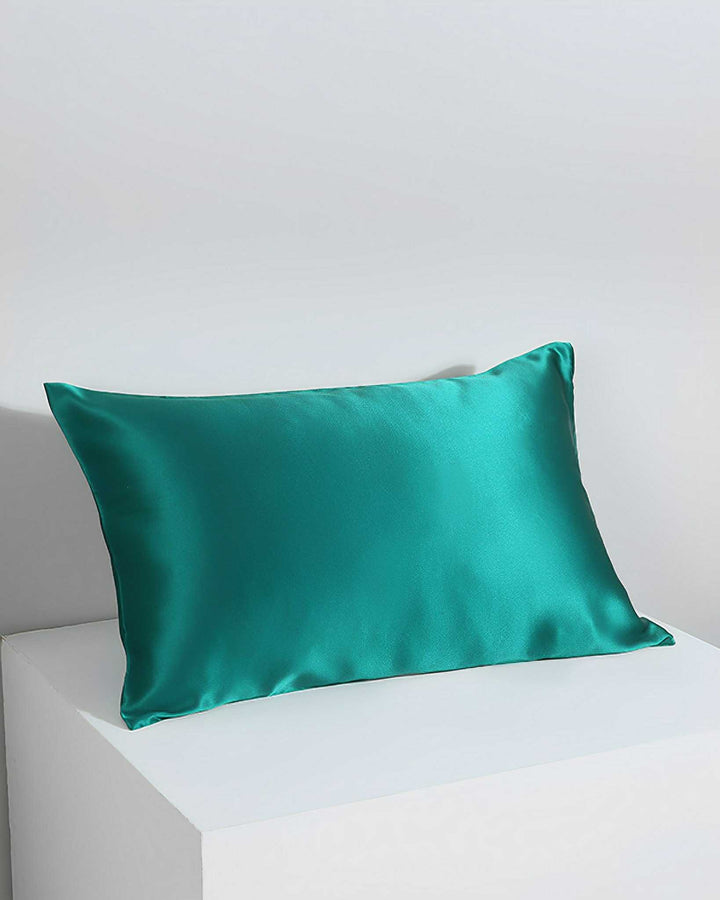 A 19 Momme Silk Pillowcase Zipper by SusanSilk in teal is displayed against a white and light gray background.