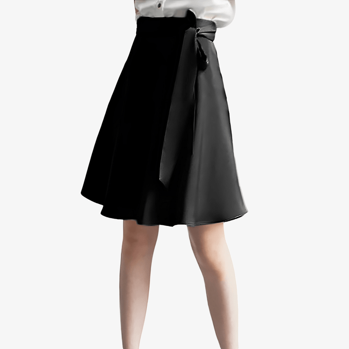 A person in a SusanSilk white silk top and Bow Tie Knee Length Silk Skirt stands against a plain background.