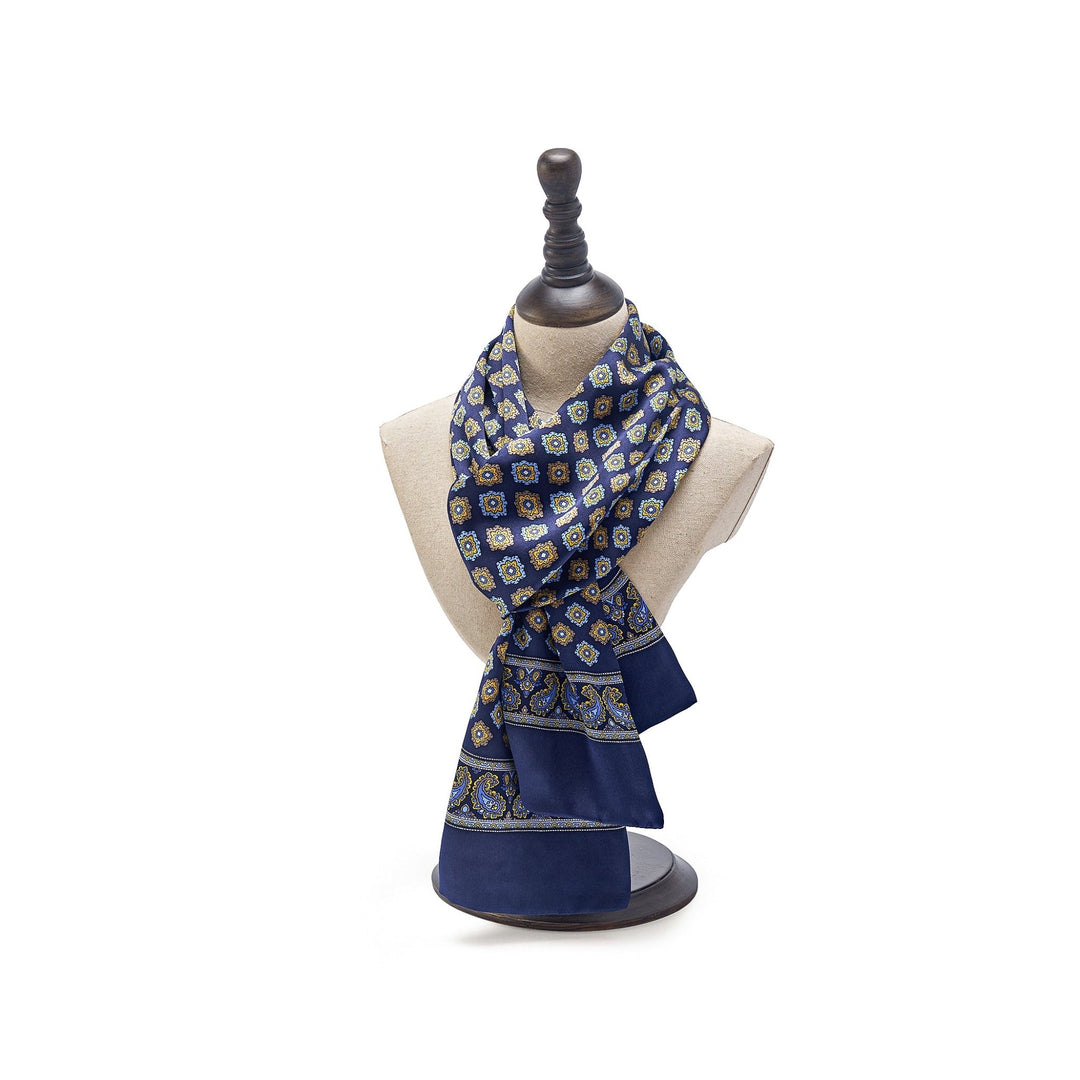 A Geometric Pattern Long Silk Scarf by SusanSilk draped on a beige mannequin bust.