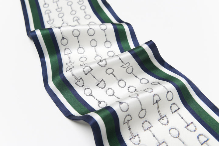 A luxurious SusanSilk Green Chain Silk Long Fluttering Belt, featuring a pattern of interconnected circles and lines bordered by green and navy stripes, is laid flat on a white surface.