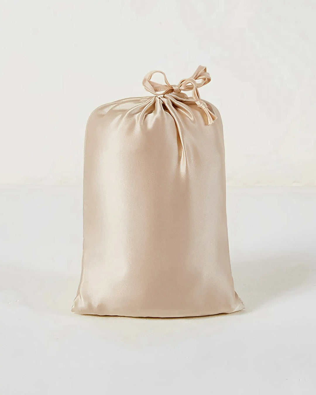 A 16 Momme Antibacterial Mulberry Silk Travel Sleep Sack by SusanSilk, in a champagne color, is pictured against a white background.