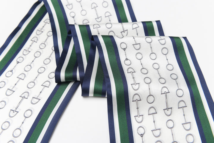 A fashion-forward accessory by SusanSilk, the Green Chain Silk Long Fluttering Belt features a lovely pattern of anchors and shovels on a pristine white, green, and blue silk background.