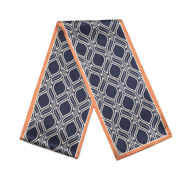 The SusanSilk Diamond Stripe Silk Long Fluttering Belt, featuring a navy blue and white geometric pattern with a light orange border, laid flat on a white background.