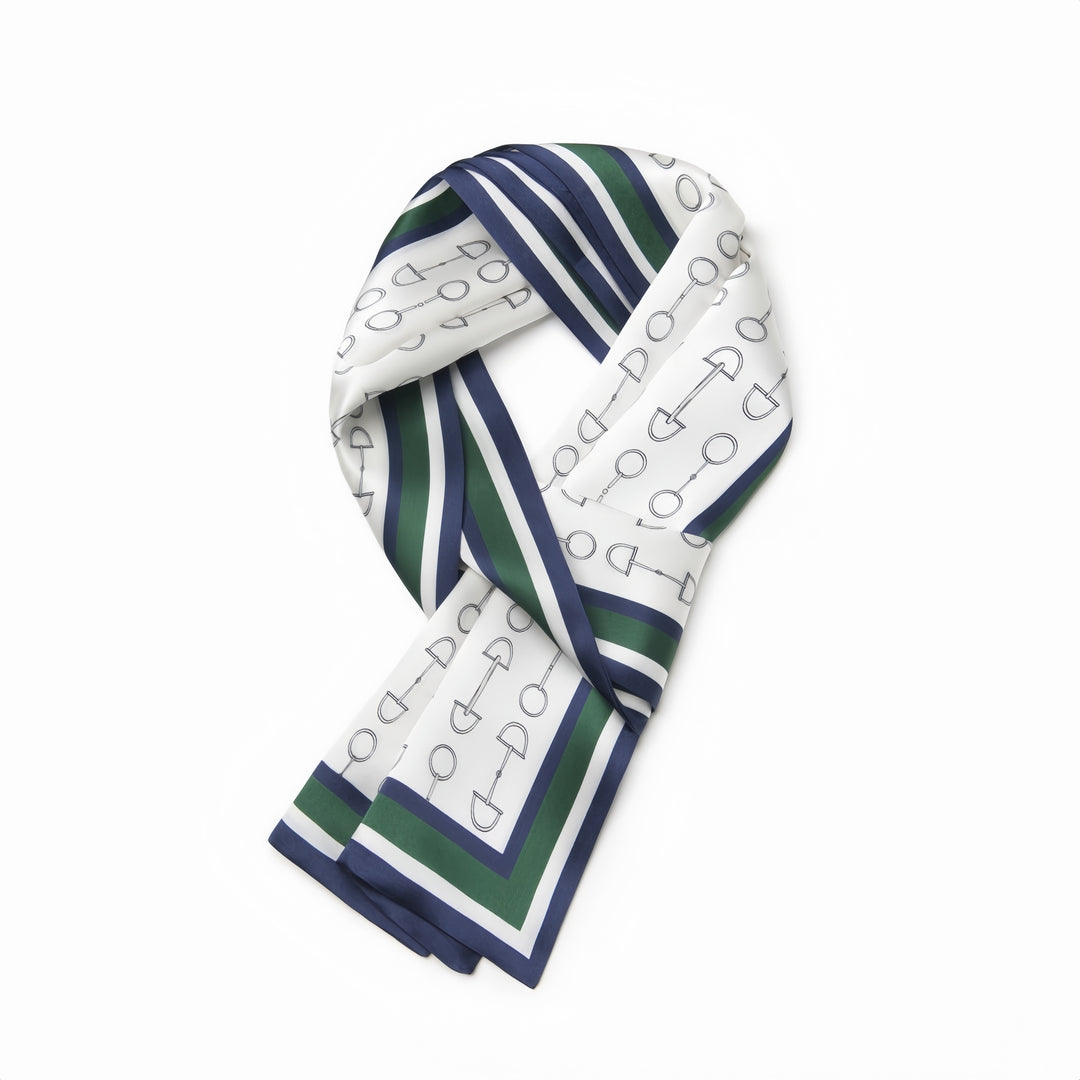 A Green Chain Silk Long Fluttering Belt from SusanSilk, adorned with a geometric pattern of circles and shovels in blue and gray, accented by blue and green striped edges, is neatly folded against a plain white background.