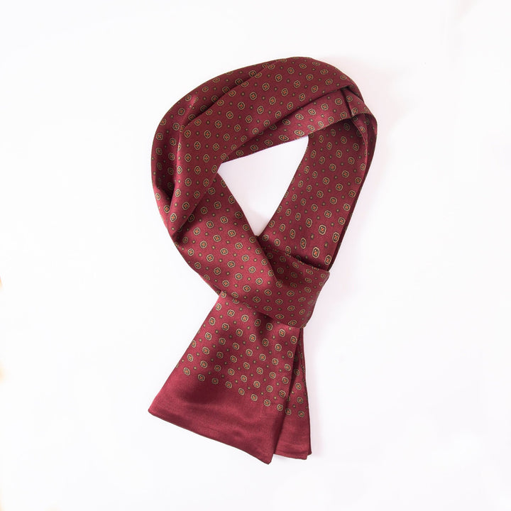 A Geometric Pattern Long Silk Scarf by SusanSilk is folded neatly against a white background.