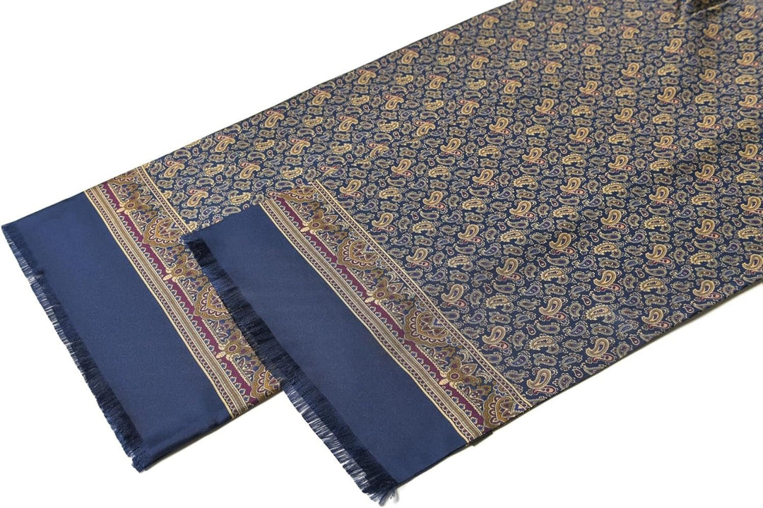 A long, patterned silk twill piece from SusanSilk, predominantly in navy, features intricate paisley designs in gold and accents with a fringed edge. This is the Paisley Men's Silk Twill Scarf - Navy.