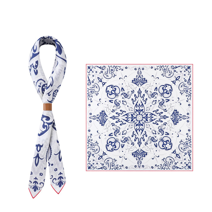 The Cashew Orchid Flower Square Silk Scarf by SusanSilk is displayed in two forms: one tied in a loop and the other laid flat, showcasing its symmetrical floral design.