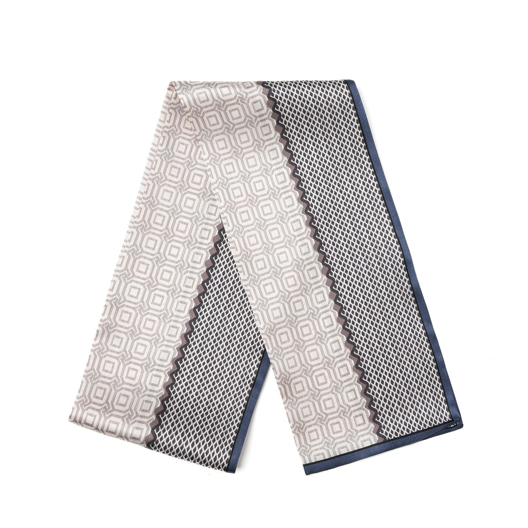 A Korean Style Silk Long Fluttering Belt with a geometric pattern in shades of cream and gray, featuring navy blue borders, crafted from luxurious SusanSilk.