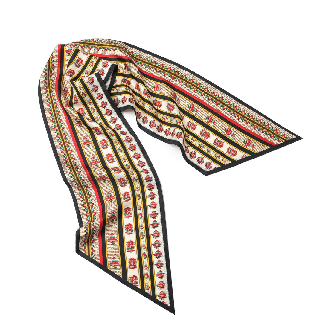 The SusanSilk 16 Momme Affordable Luxury Silk Twill Long Silk Scarf-Crushed Flower, adorned with a geometric pattern in red, white, and yellow colors and accentuated by black borders, lies flat against a white background.