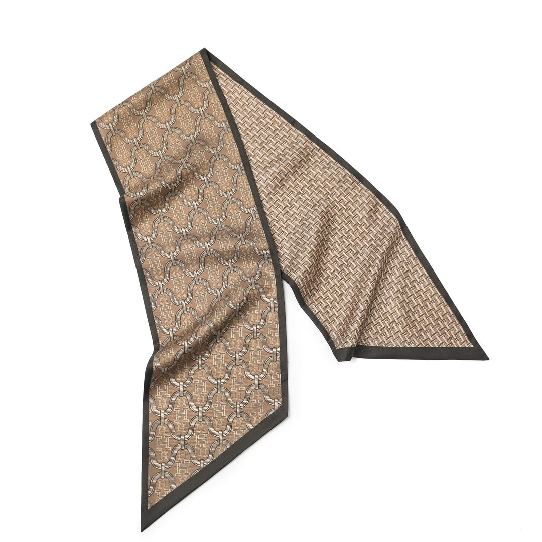 The 16 Momme Affordable Luxury Silk Twill Long Silk Scarf-Classic H Style from SusanSilk showcases an intricate geometric pattern in brown and beige tones, elegantly bordered with a thin black trim.