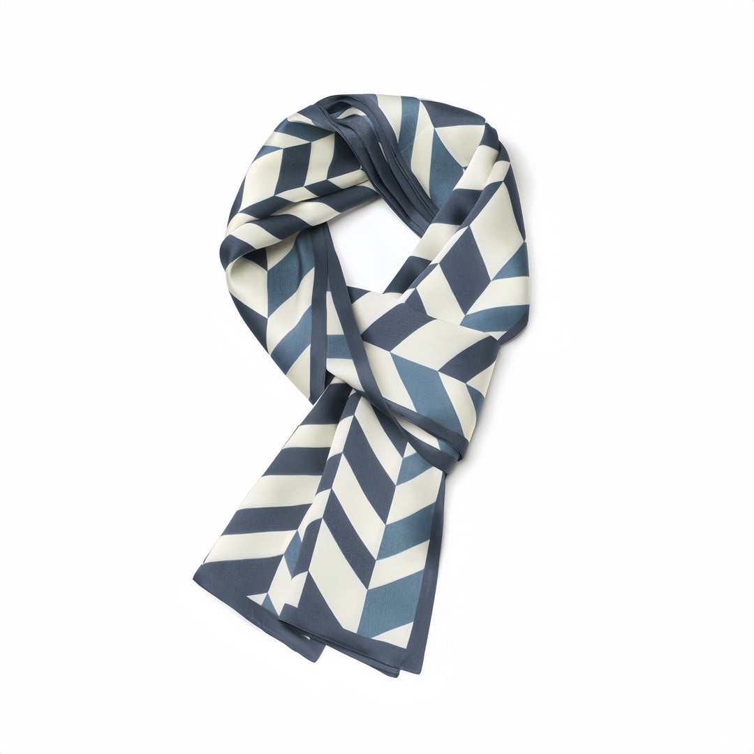 A Blue Staircase Silk Long Fluttering Belt by SusanSilk, featuring a geometric chevron pattern in dark blue and white, neatly arranged against a plain white background.