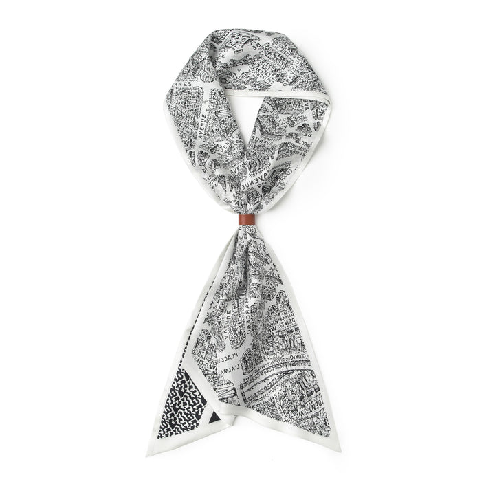 A 16 Momme Affordable Luxury Silk Twill Long Silk Scarf-Black & White City, neatly tied in a loop with its ends delicately hanging down, showcases the elegance of SusanSilk.