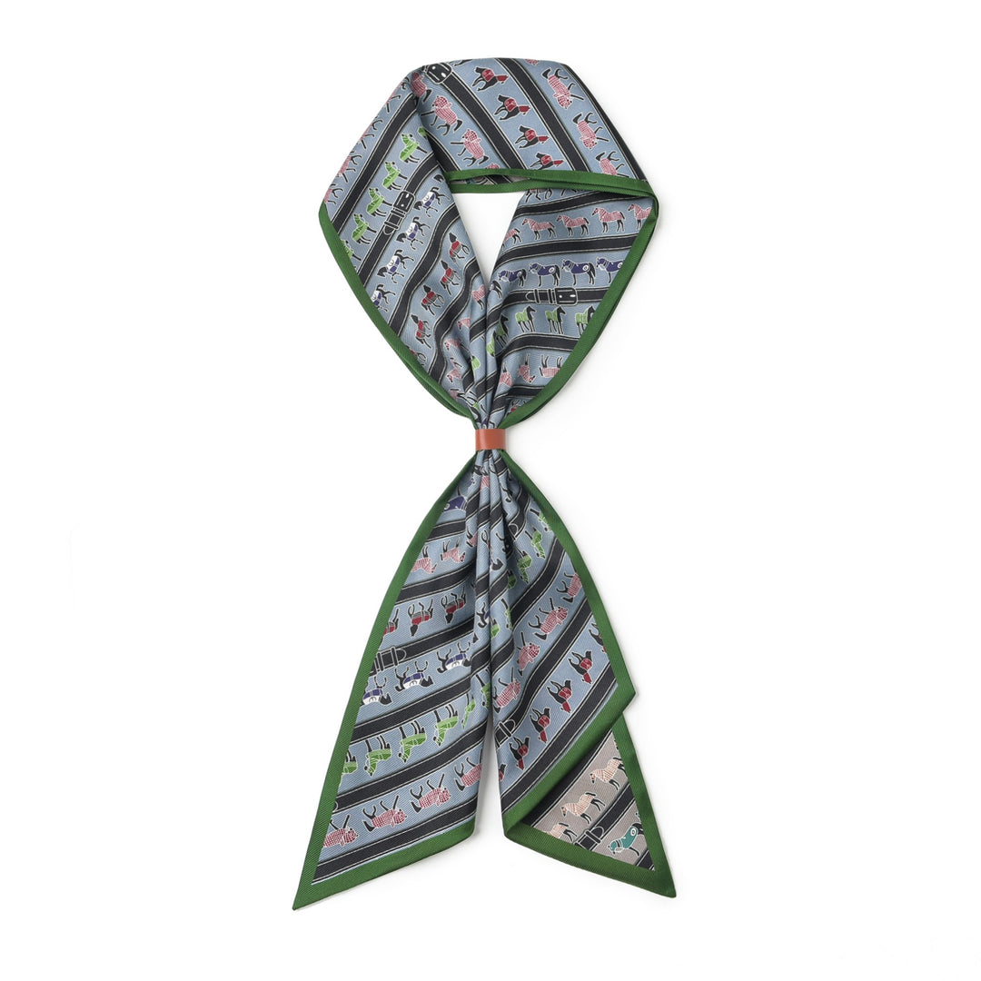 A SusanSilk 16 Momme Affordable Luxury Silk Twill Long Silk Scarf in Green Pony, featuring illustrations of horses and carriages, tied in a simple knot against a white background.