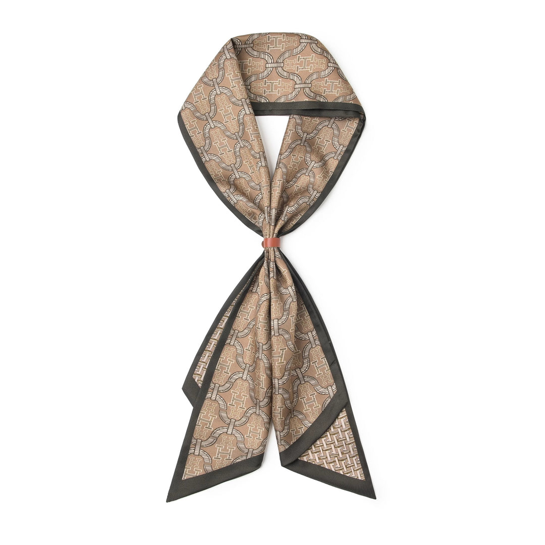 A SusanSilk 16 Momme Affordable Luxury Silk Twill Long Silk Scarf-Classic H Style, featuring a brown and beige pattern with black borders, tied in a neat cravat style.