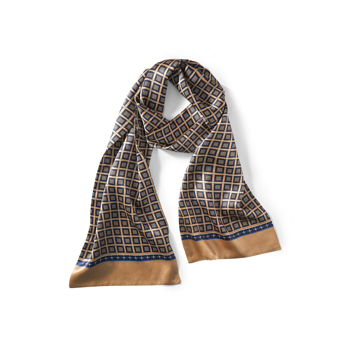 A Journey Grid Series Long Silk Scarf by SusanSilk, featuring a diamond grid design in black, white, and gold with gold and blue bordering, crafted from luxurious silk.