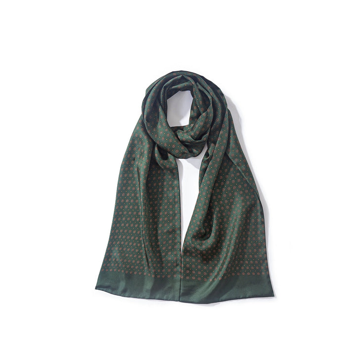 A Geometric Pattern Long Silk Scarf in dark green silk, featuring a subtle pattern of small, evenly spaced shapes, neatly folded on a white background by SusanSilk.