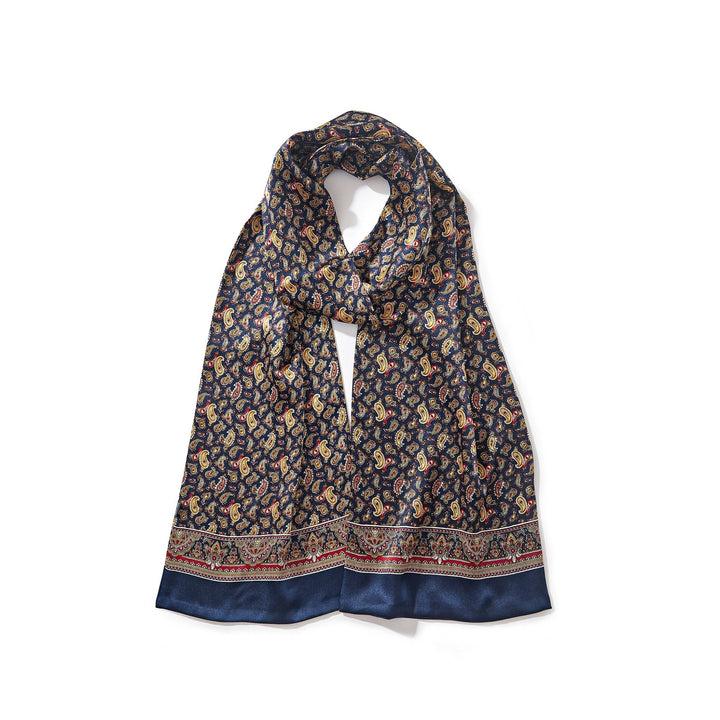 A SusanSilk Paisley Series Long Silk Scarf in navy blue with a decorative border.