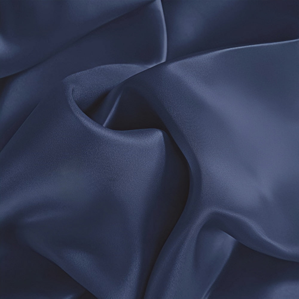 Close-up of the dark blue New Arrival 22 Momme Silk Pillowcase Envelope by SusanSilk, featuring smooth, flowing folds and a glossy texture.