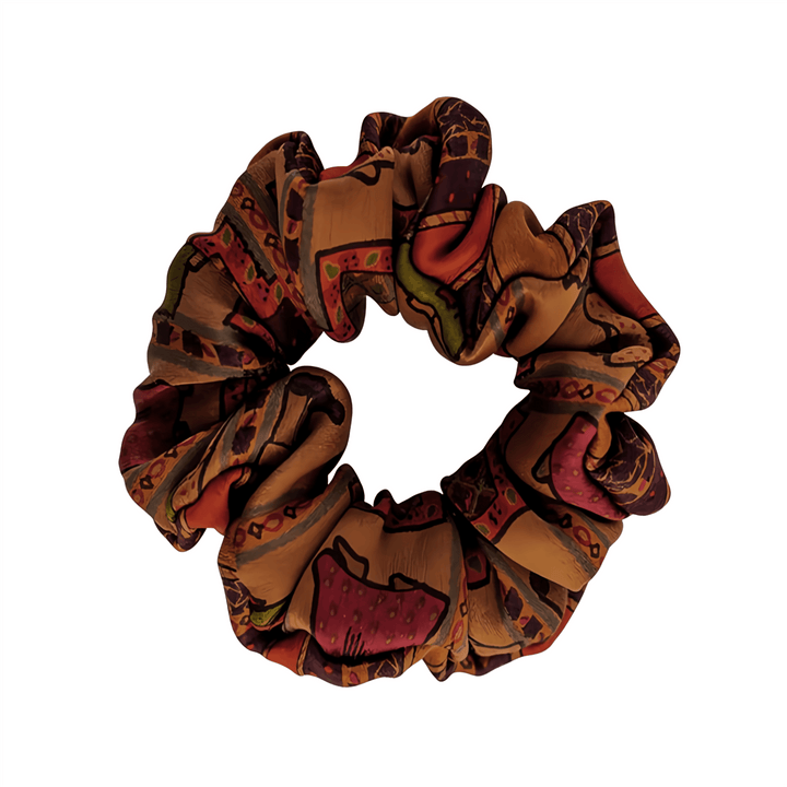 The Gambiered Canton Gauze Silk Scrunchie by SusanSilk features a luxurious fabric with an earthy, abstract pattern in shades of brown, red, and green.