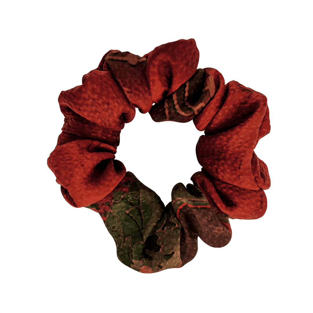 A Gambiered Canton Gauze Silk Scrunchie (3cm) in red and green from SusanSilk is shown against a white background.