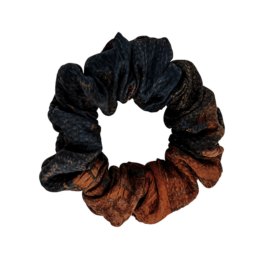 A 3cm Gambiered Canton Gauze Silk Scrunchie from SusanSilk with a textured mix of dark blue and brown colors.