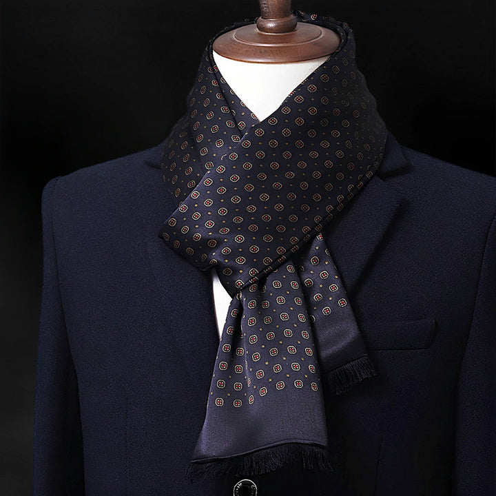 A black mannequin dressed in a dark suit and tie is adorned with a black SusanSilk Geometric Series Long Silk Brushed Scarf wrapped around its neck.