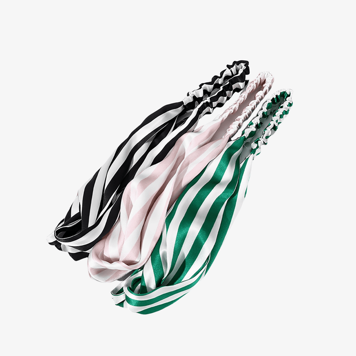 Three Stripe Criss Cross Silk Headbands from SusanSilk, available in black and white, pink and white, and green and white combinations, are arranged side by side on a white background. SusanSilk adds a luxurious touch to these chic accessories.