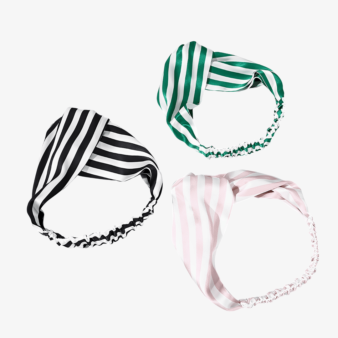 Three Stripe Criss Cross Silk Headbands by SusanSilk, featuring twisted knot designs in black and white stripes, green and white stripes, and pink and white stripes, arranged on a plain white background.