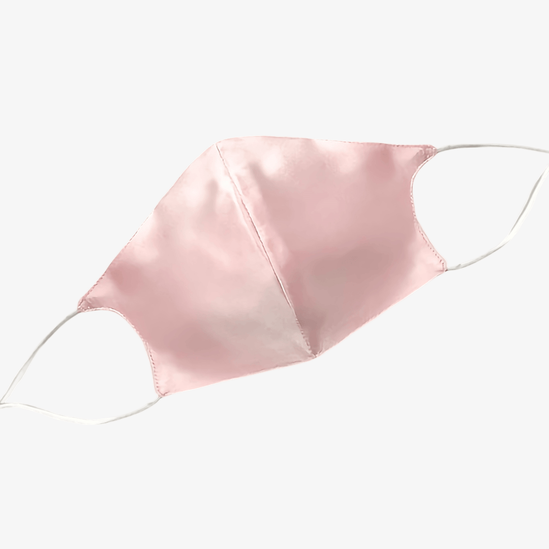 A pink SusanSilk Double Layer Silk Face Mask with Nose Wire, featuring white elastic ear loops, displayed against a white background.