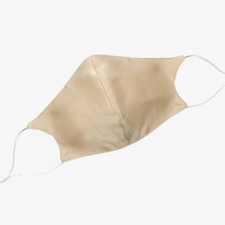 A beige-colored Double Layer Silk Face Mask with Nose Wire from SusanSilk, featuring white ear loops.