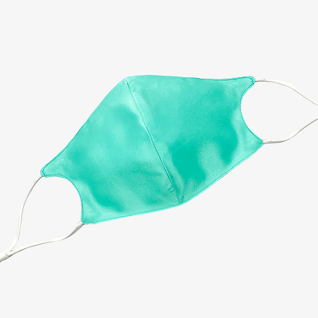 A teal Double Layer Silk Face Mask with white elastic ear loops from SusanSilk is displayed against a white background.