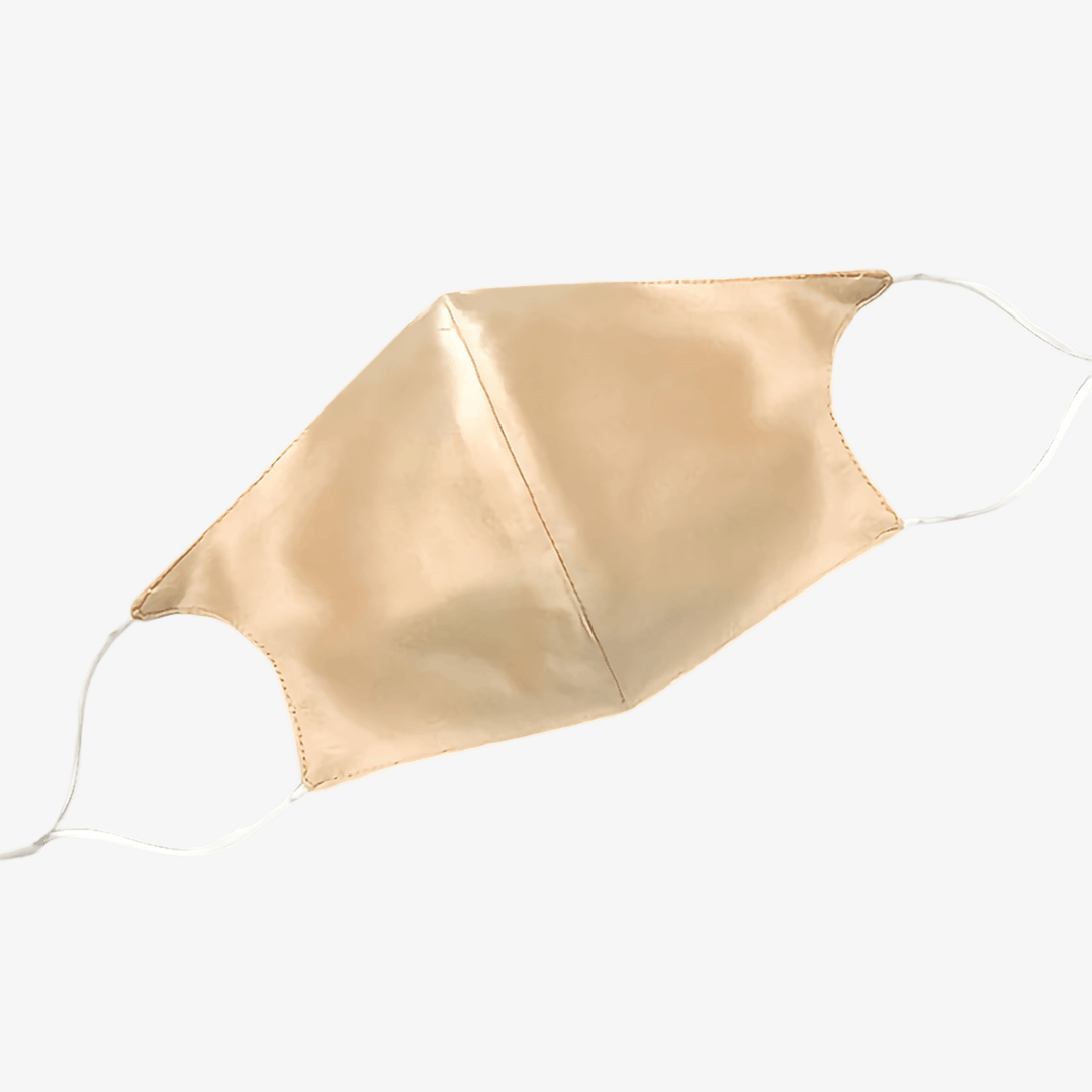 A SusanSilk Double Layer Silk Face Mask with nose wire and ear loops, in beige, laid flat on a white background.