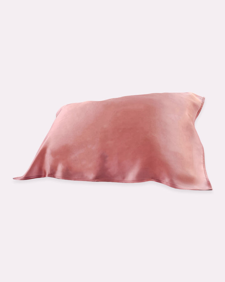 A 19 Momme Baby & Toddler Silk Pillow Cover from SusanSilk, in a cameo brown hue, is displayed against a white background, offering natural and cozy sleep.