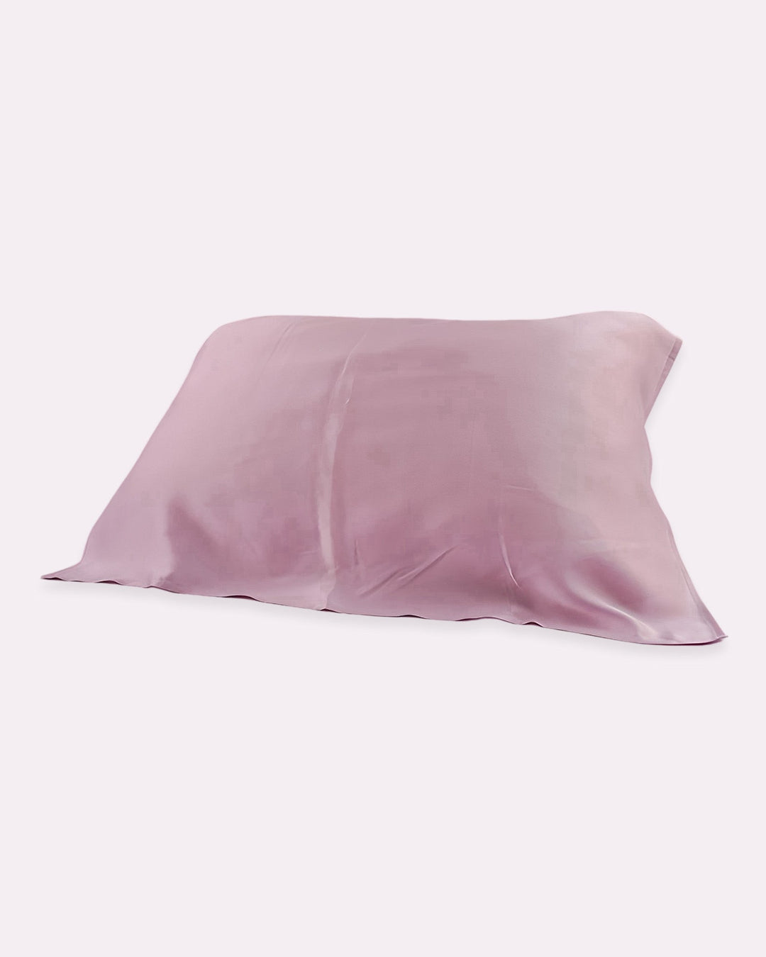 The 19 Momme Baby & Toddler Silk Pillow Cover from SusanSilk, in a delightful Mauve shade, is presented against a white backdrop and promises a natural and cozy sleep with its 100% silk composition.