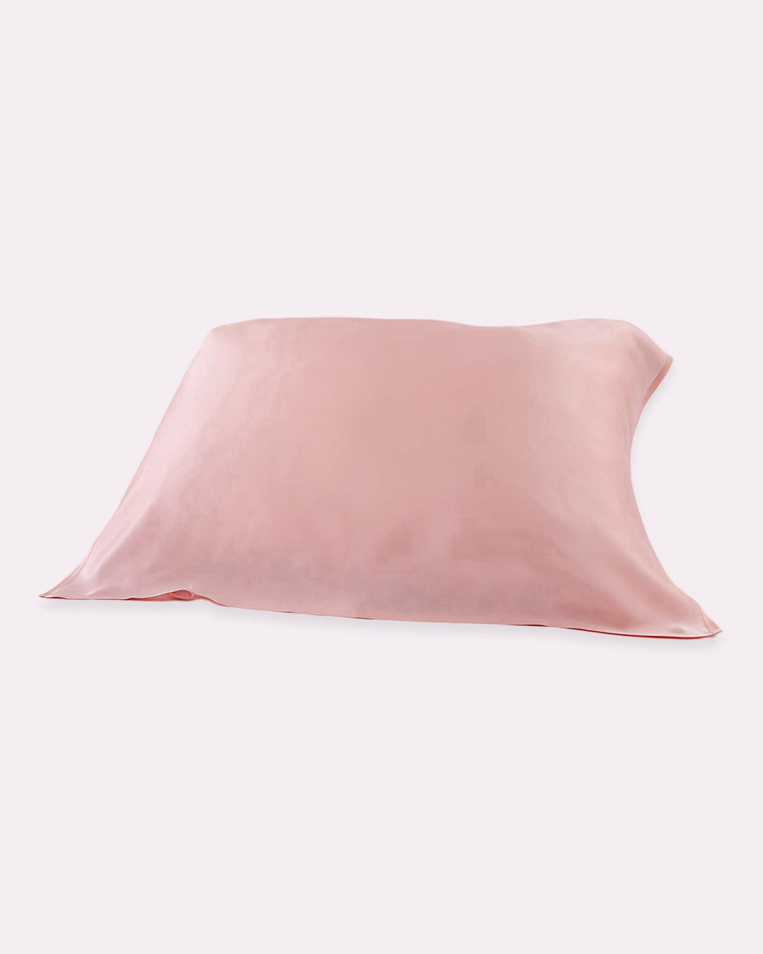 A light pink 19 Momme Baby & Toddler Silk Pillow Cover from SusanSilk lies flat on a white background. Crafted from 100% silk and featuring eco-friendly reactive printing, it promises a natural and cozy sleep.