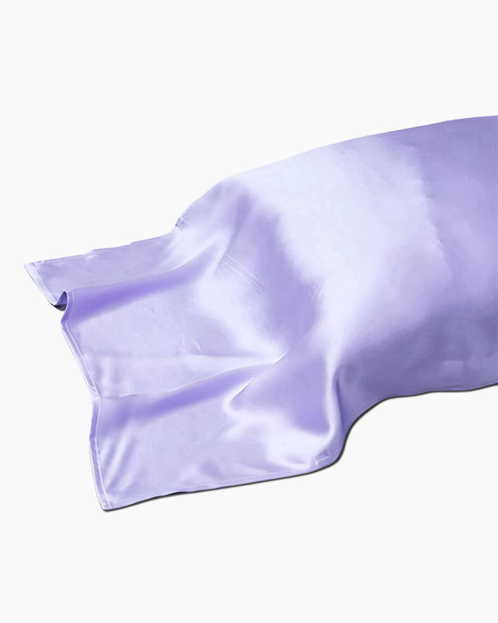 A 19 Momme Colorful Silk Pillow Cover from SusanSilk in light purple is laid out flat against a white background.