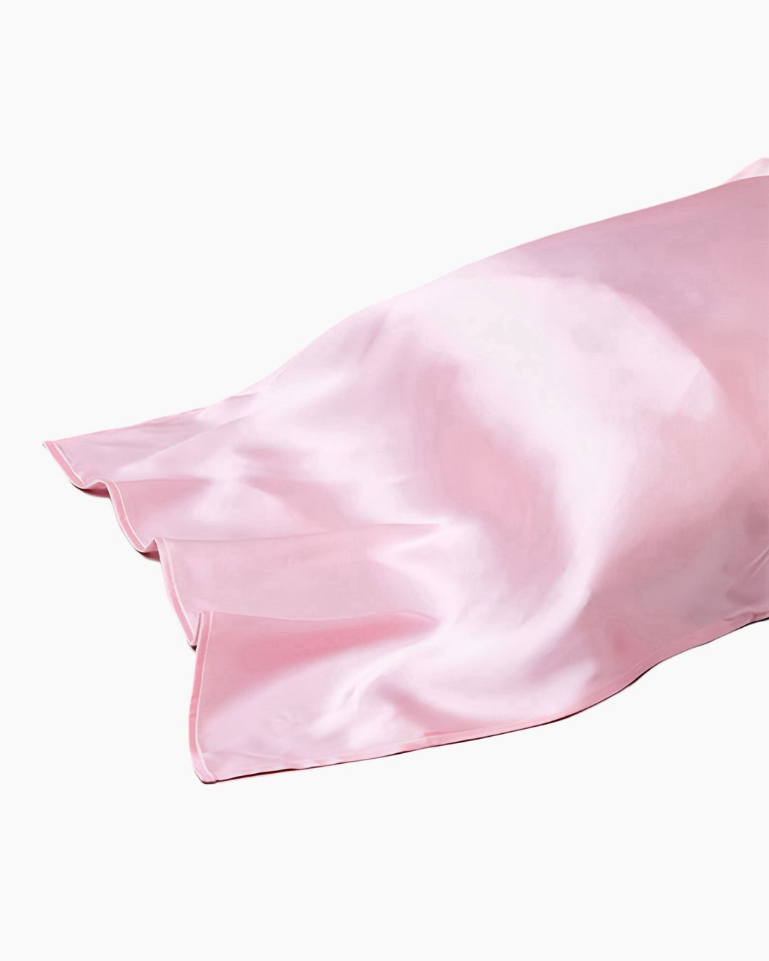 A close-up view of a SusanSilk 19 Momme Colorful Silk Pillow Cover in pink on a white background.