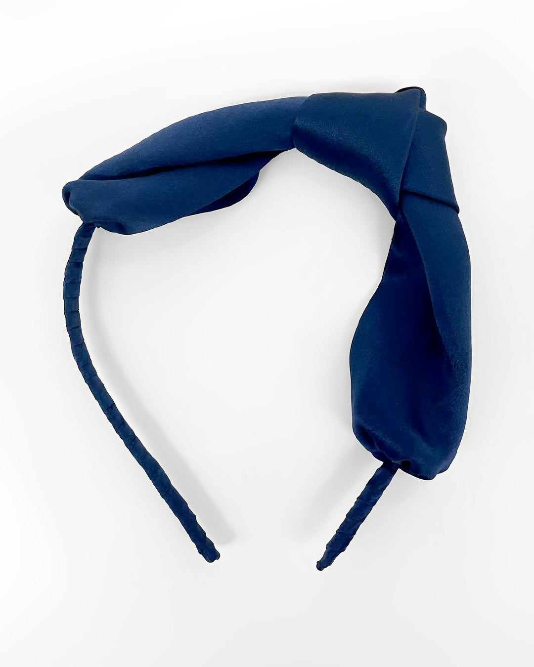 Introducing the Pure Color Bow Knot Silk Headband by SusanSilk, a navy blue accessory featuring a twisted fabric design and a flexible band for added comfort.