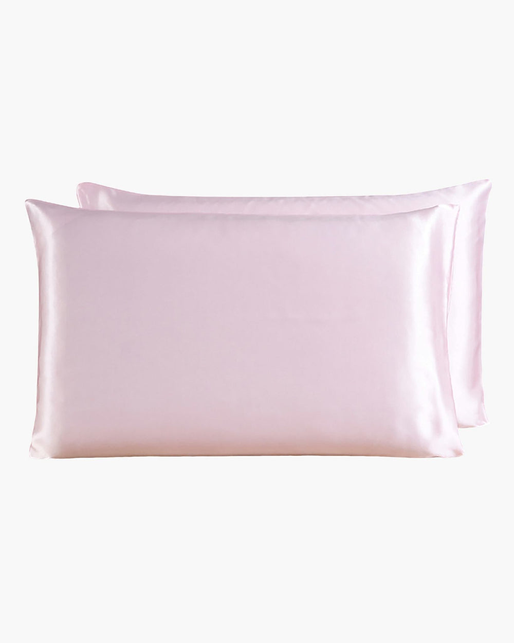 Two SusanSilk 22 Momme Beauty Silk Pillowcase Zippers in pale pink are placed against a plain white background, showcasing their luxurious feel that rivals even the finest silk.