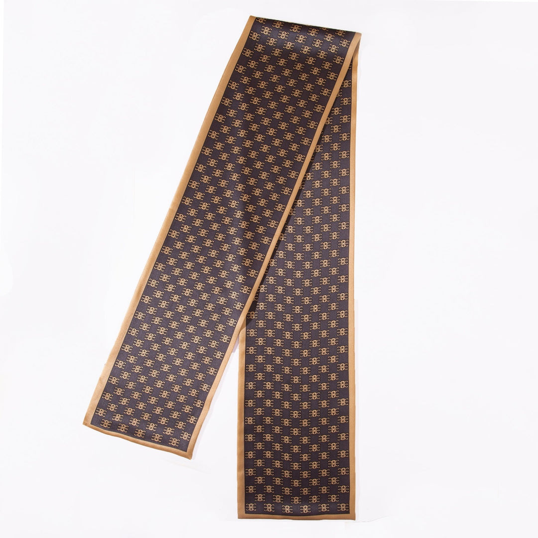 The Arc De Triomphe Narrow Long Silk Scarf by SusanSilk features a geometric pattern on a long, dark brown silk background with light brown borders.