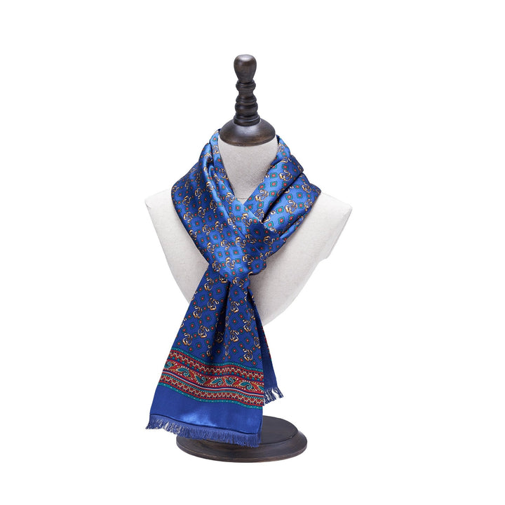 The elegant Buckle Pattern Long Silk Brushed Scarf, by SusanSilk, drapes gracefully on a mannequin bust with a dark wooden base, showcasing its luxurious texture.