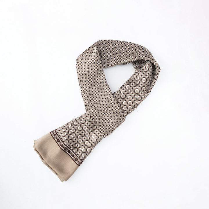 A light brown Cross Pattern Long Silk Scarf by SusanSilk lies folded on a white background.