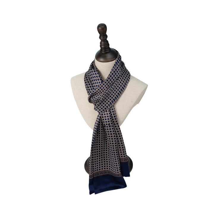 A Cross Pattern Long Silk Scarf by SusanSilk displayed on a white bust mannequin with a dark wooden base.