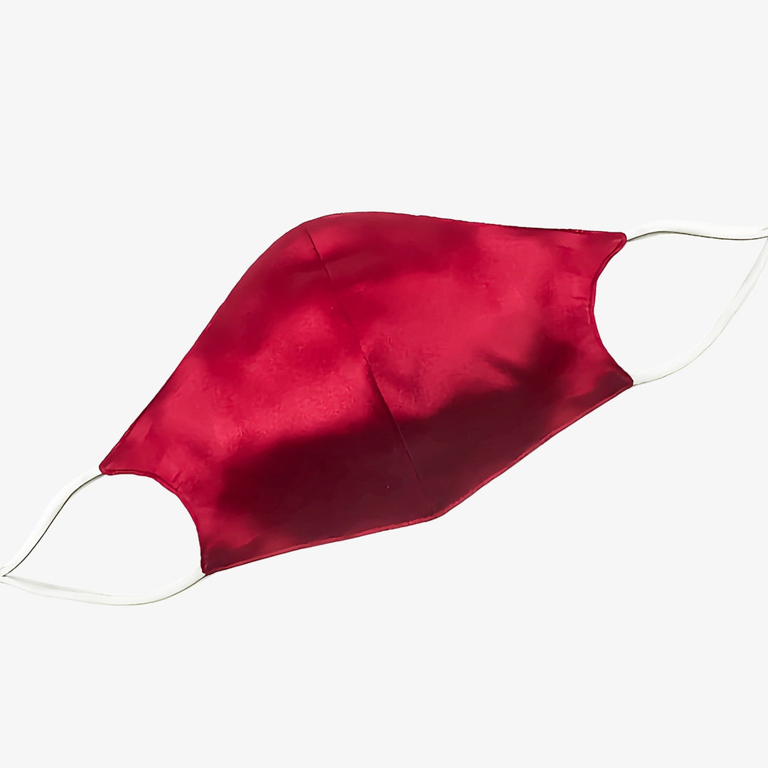 A luxurious red Double Layer Silk Face Mask with white ear loops from SusanSilk, part of a 3-piece set and featuring a nose wire, is shown on a plain white background.