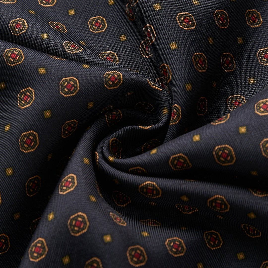 Close-up of the Geometric Pattern Long Silk Brushed Scarf - Black from SusanSilk, featuring a geometric design with octagons and squares in red, gold, and brown hues.