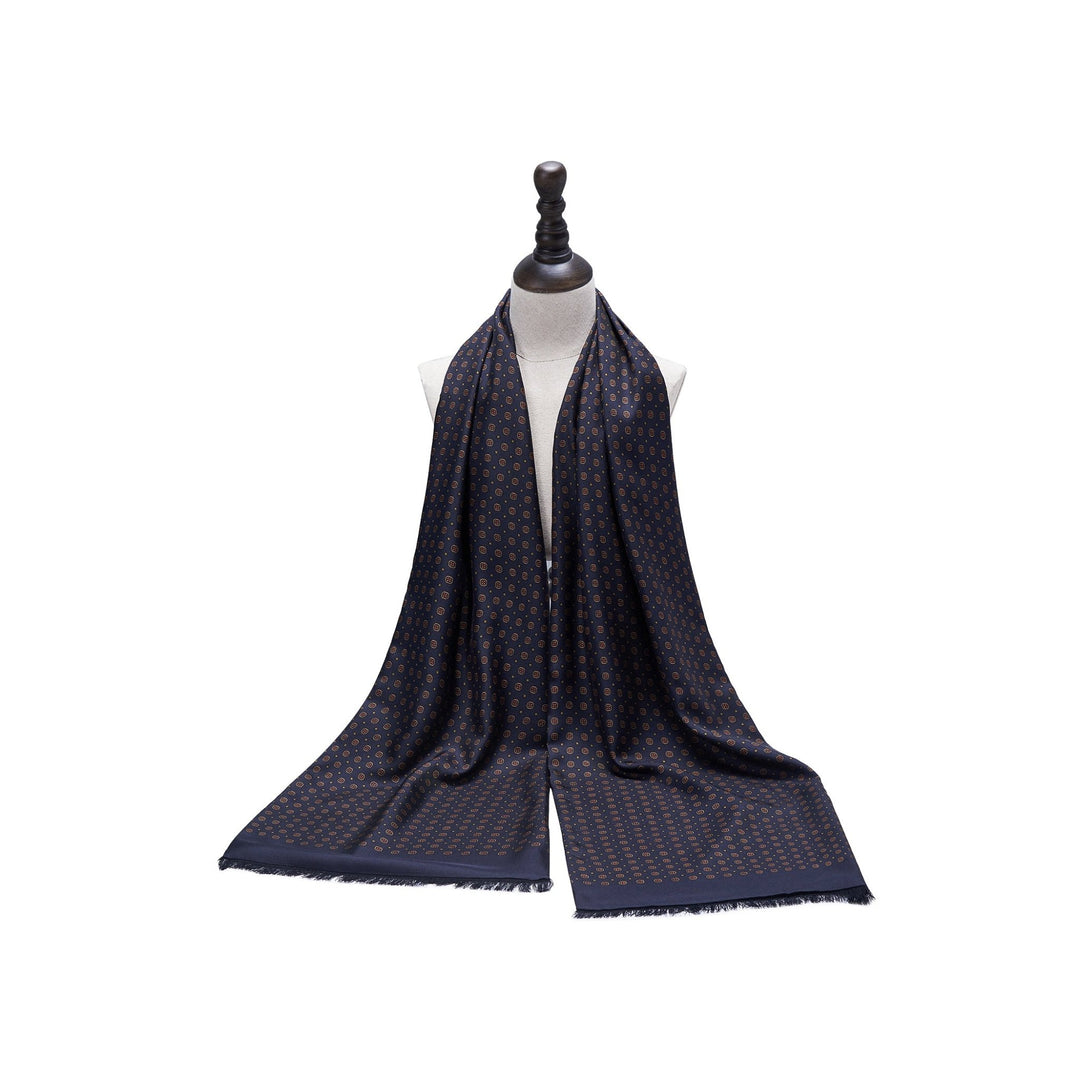 A SusanSilk Geometric Patterned Long Silk Brushed Scarf in black displayed on a mannequin with a light background.