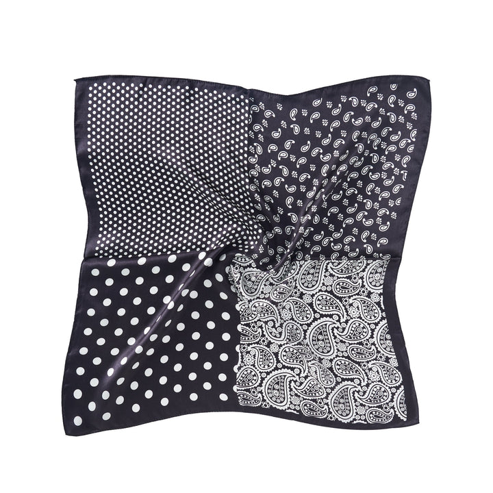 Introducing the Jigsaw Series Square Silk Scarf by SusanSilk: an exquisite black and white scarf divided into four distinct sections, each showcasing unique patterns – small dots, paisley, large dots, and a denser paisley design.