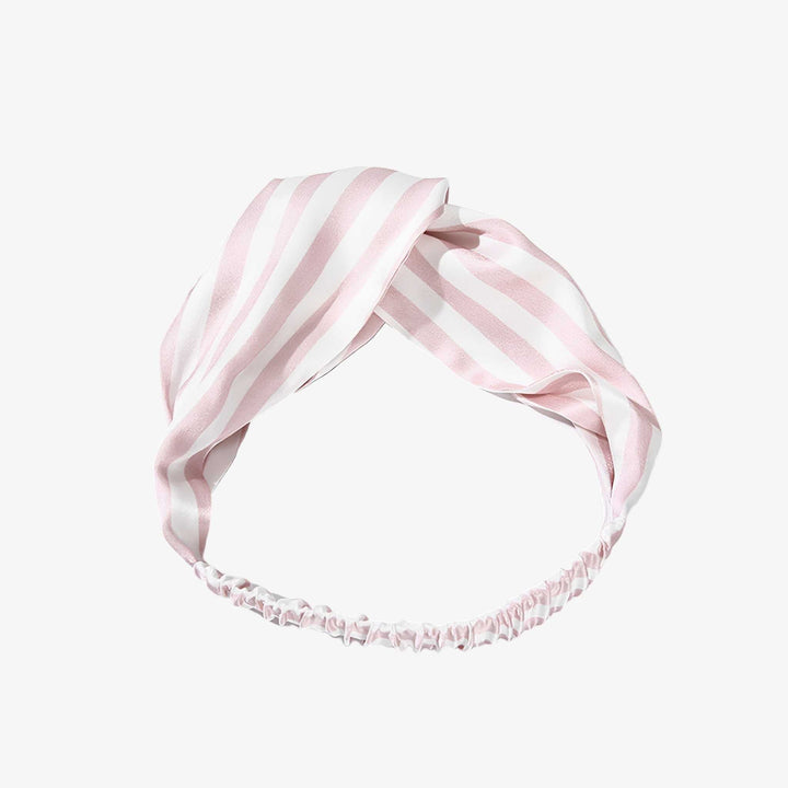 The Stripe Criss Cross Silk Headband by SusanSilk features a pink and white striped design as well as an elasticized back.