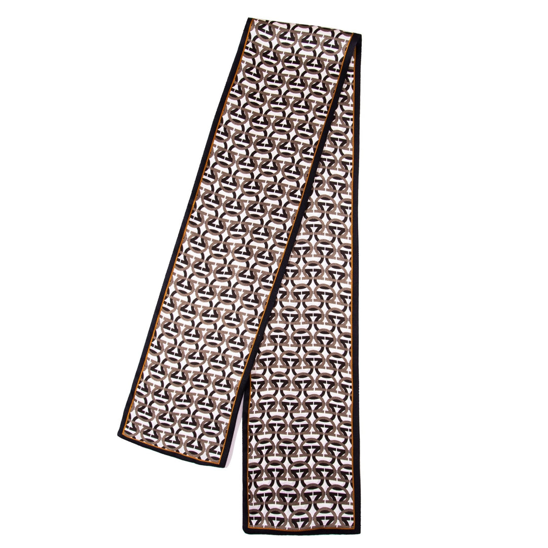 The SusanSilk Ohm Pattern Narrow Long Silk Scarf features a striking geometric design in black, white, and brown, complemented by a solid black border.